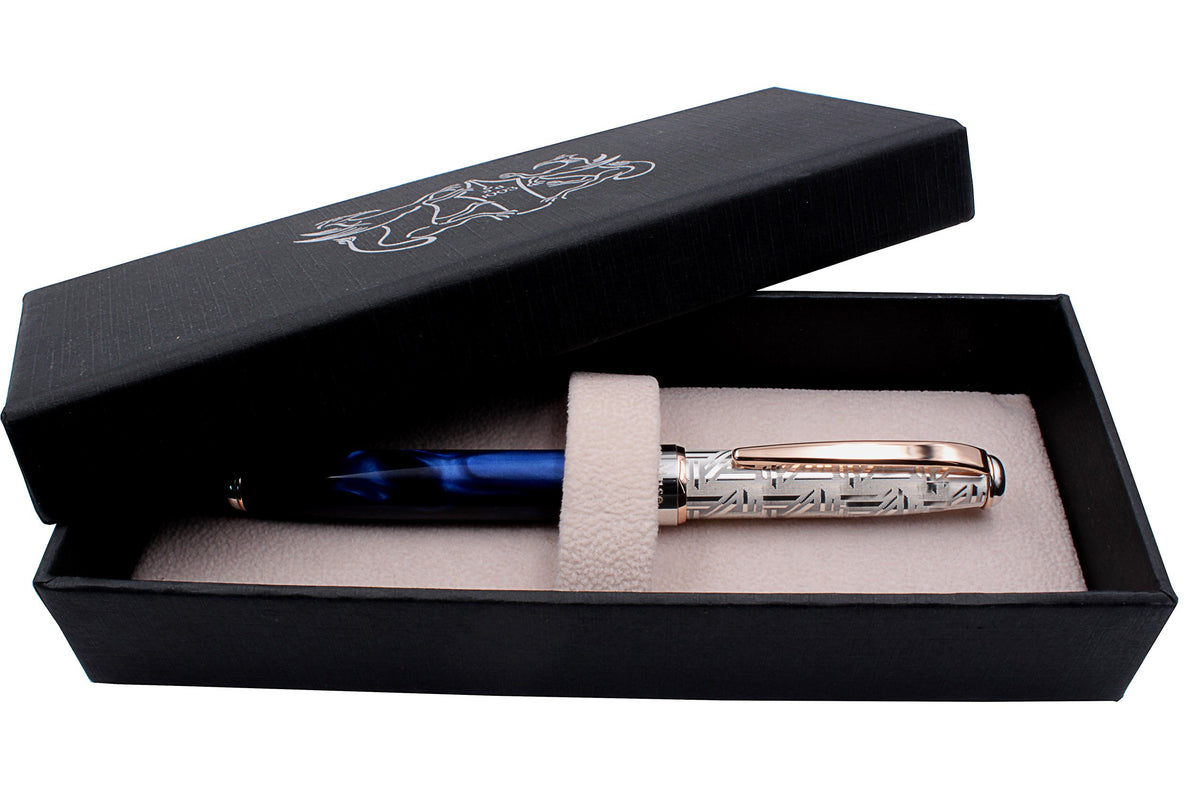 Silver and blue resin rollerball pen inside its Grifos gift box
