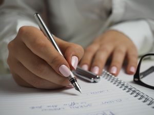Writing by hand with a pen