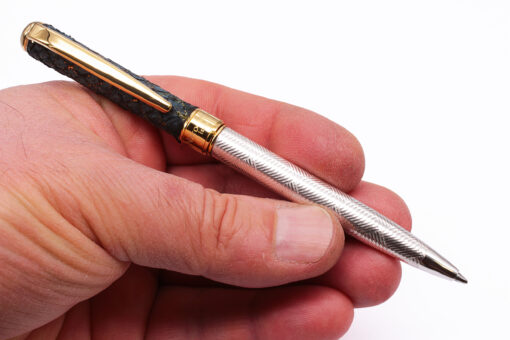 Artisan made pen in natural fhish leather and engraved silver.