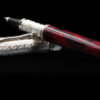 silver and burgundy resin rollerball pen